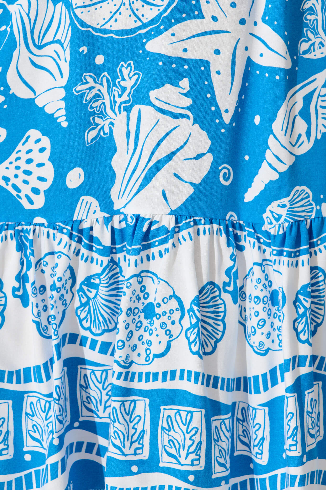 Kimbra Dress In Blue and White Shell Print