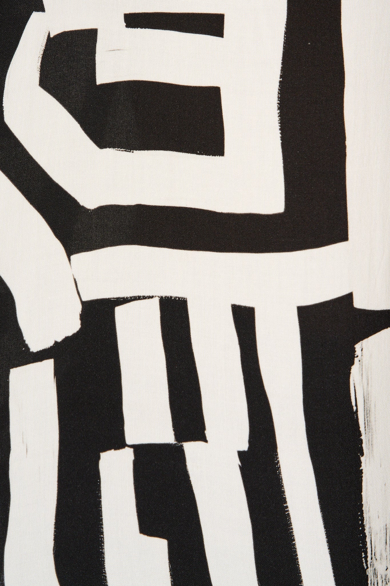 Solara Top in Black with White Geometric Print