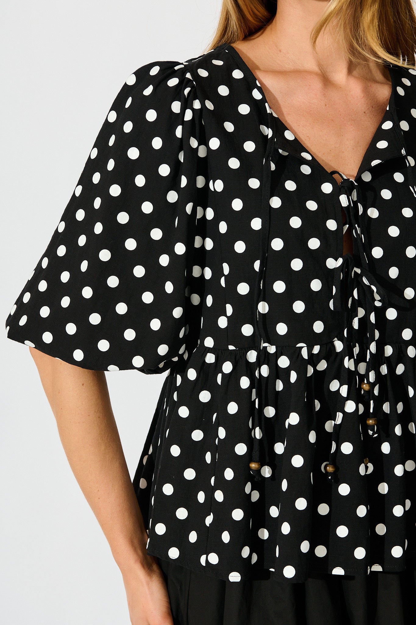 In the Spotlight Tie Front Top in Black with White Polka Dot