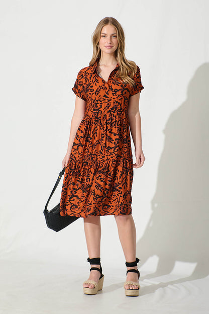 Ann Smock Dress in Rust with Black Print