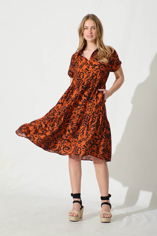 Ann Smock Dress in Rust with Black Print