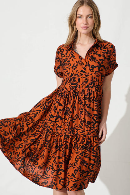 Ann Smock Dress in Rust with Black Print