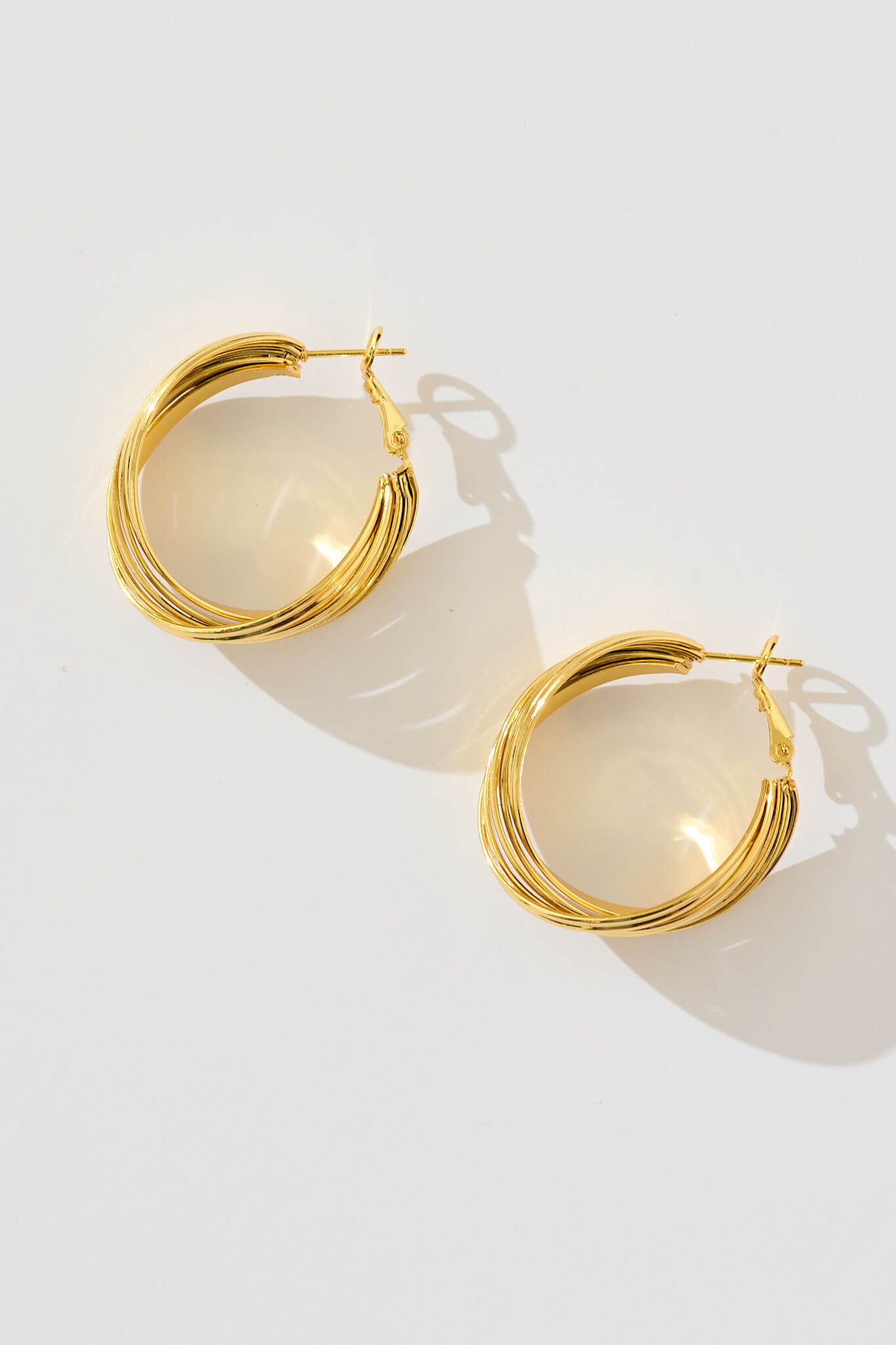 Hana Twisted Ridge Hoop Earrings in Gold