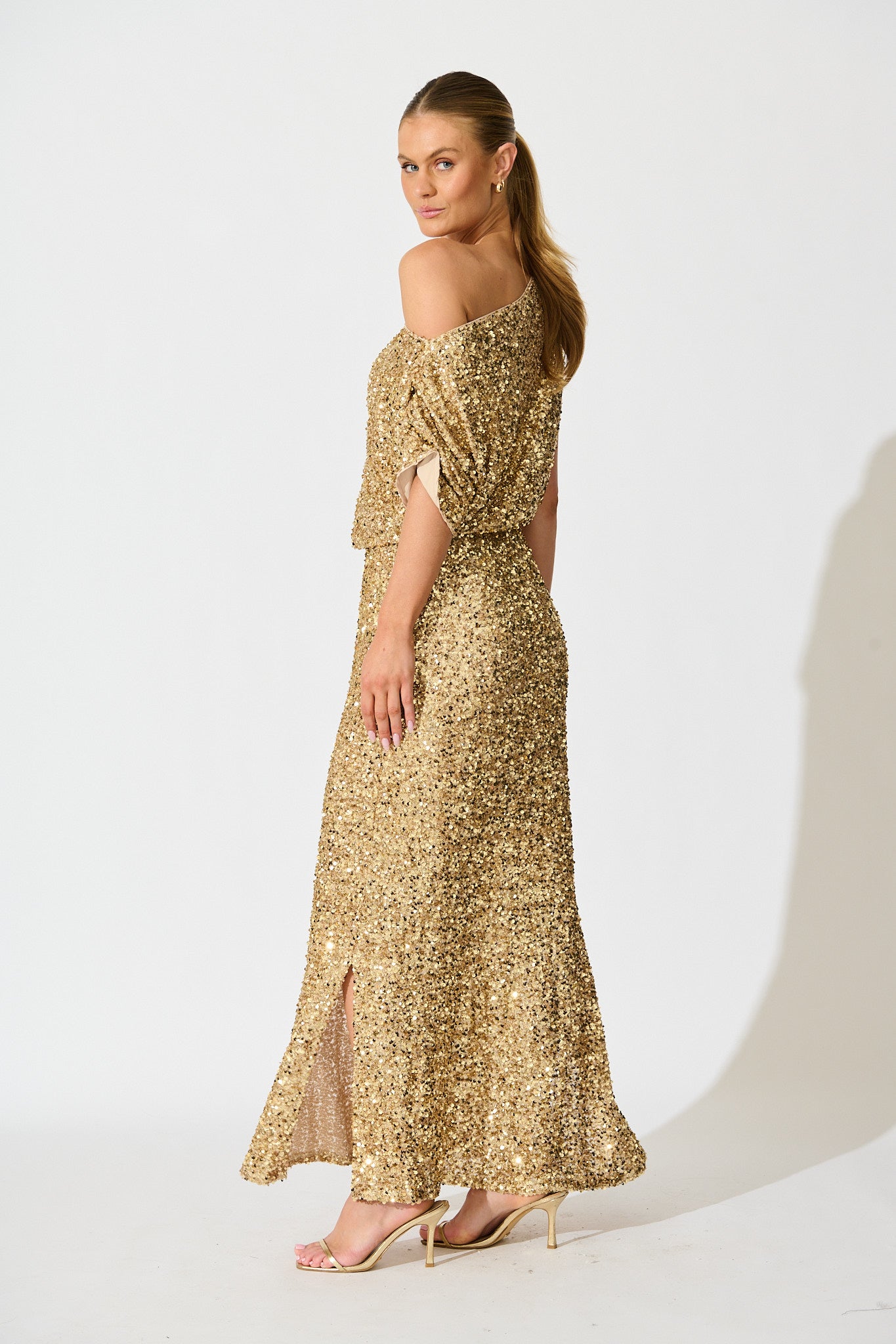 Amiri Off Shoulder Maxi Dress in Gold Sequin