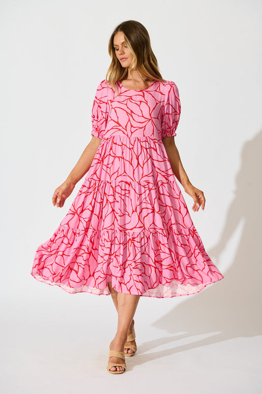 Nevi Tiered Midi Dress In Pink With Red Swirl Print