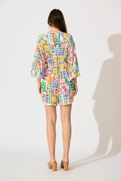 Otillie Playsuit in White Multi Conversational Print