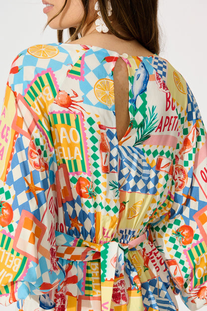 Otillie Playsuit in White Multi Conversational Print